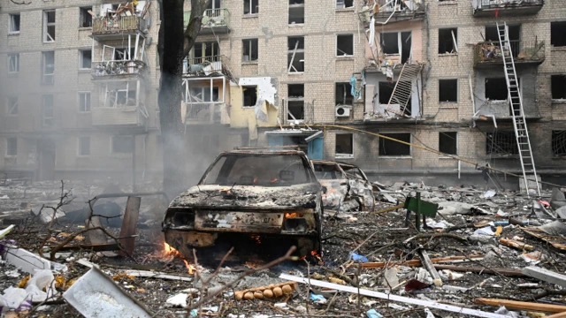 Russia launches deadly missile strikes across Ukrainian cities 2 This photograph taken on 23 January 2024 shows destroyed vehicles in front of a residential building destroyed as a result of a missile attack in Kharkiv. (Picture: SERGEY BOBOK/AFP)