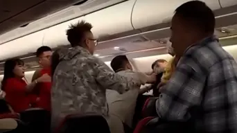 WATCH: Brawling on plane as women hit man asking them to 'shut up' WATCH: Brawling on plane as women hit man asking them to 'shut up'