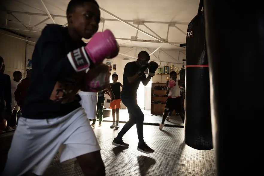 A late-afternoon training session at the academy. Coach Kamko offers boxing classes. Luzuko Dyantyi and Grant Quixley offer cycling coaching as well as tutoring sessions for students. Picture: David Harrison/@GroundUp News A late-afternoon training session at the academy. Coach Kamko offers boxing classes. Luzuko Dyantyi and Grant Quixley offer cycling coaching as well as tutoring sessions for students. Picture: David Harrison/@GroundUp News