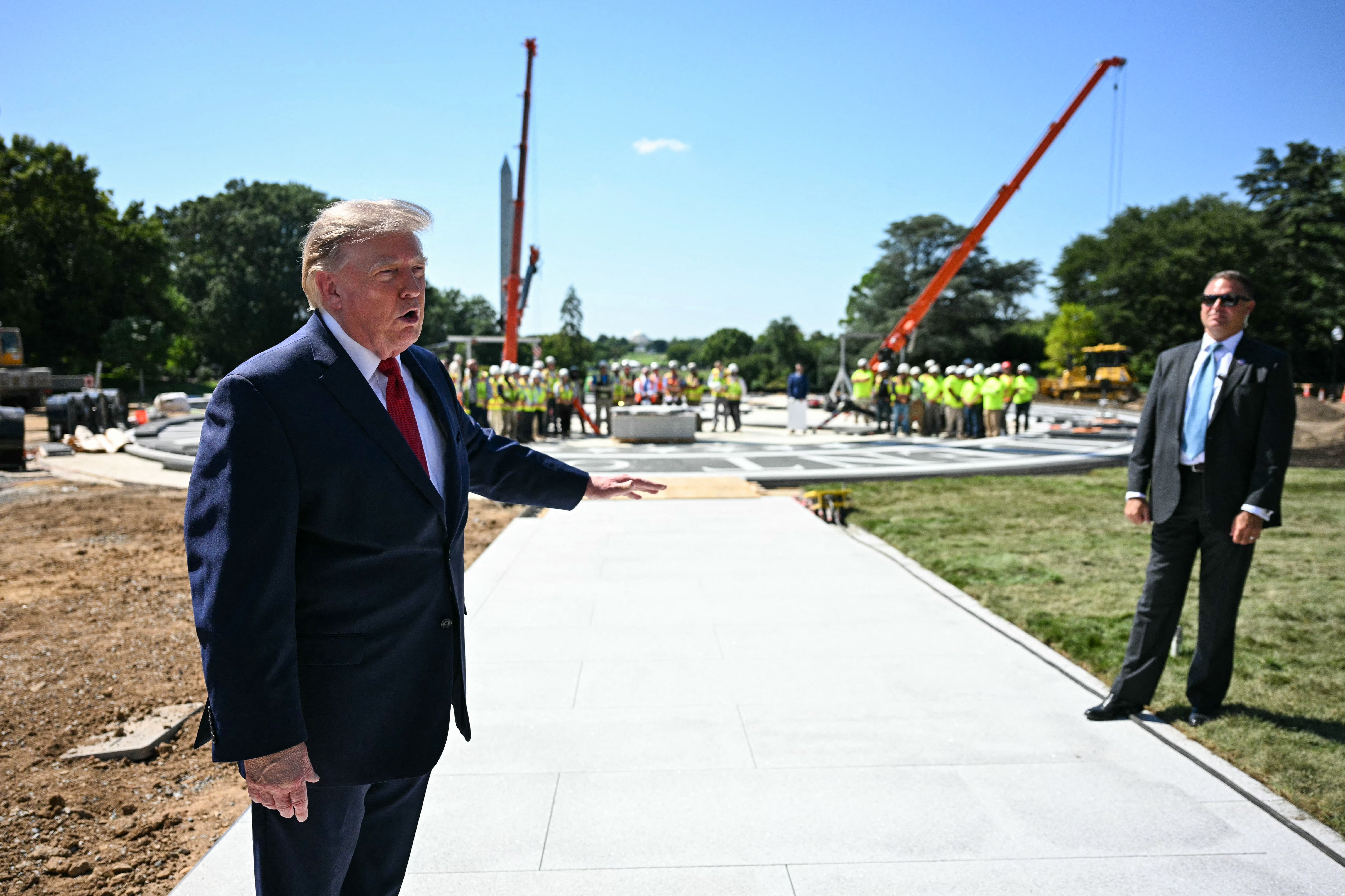 Trump unveils White House helipad as building frenzy escalates