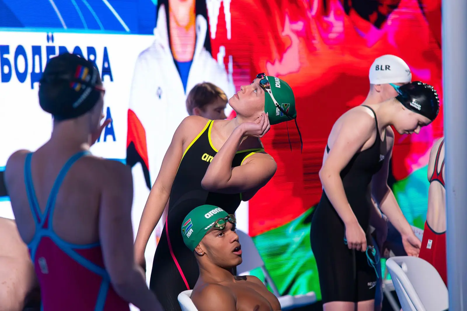 Swimmer Scarlett Le Roux(green cap) brings home two medals (bronze and silver) from the Belarus Swimming Cup. Picture: Supplied. Swimmer Scarlett Le Roux(green cap) brings home two medals (bronze and silver) from the Belarus Swimming Cup. Picture: Supplied.