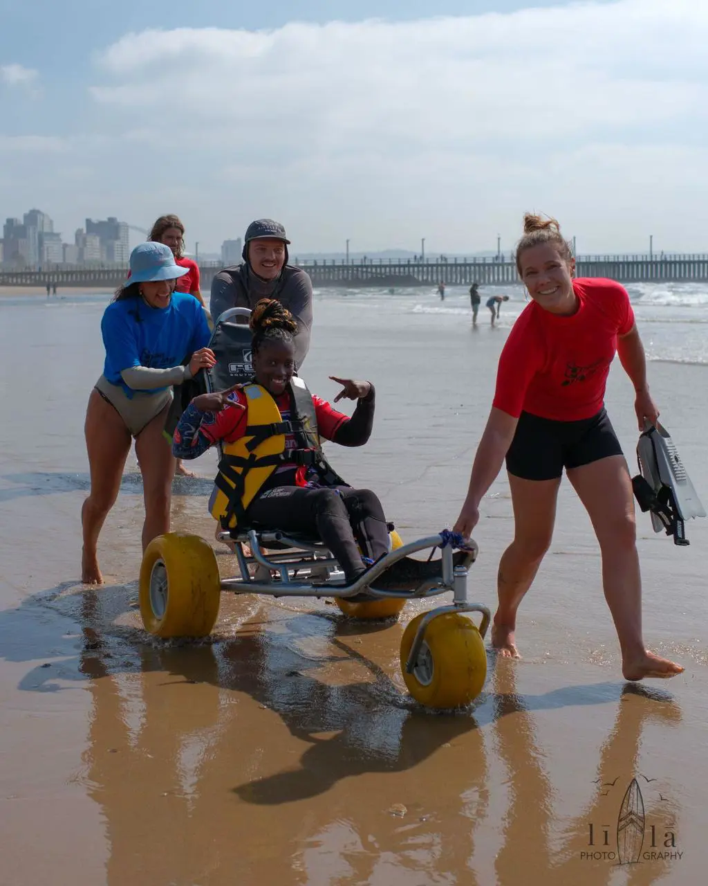 Noluthando Makalima, with her support team, which helps her get her in and out of the water for competitions. Picture: Neo Pillay Noluthando Makalima, with her support team, which helps her get her in and out of the water for competitions. Picture: Neo Pillay