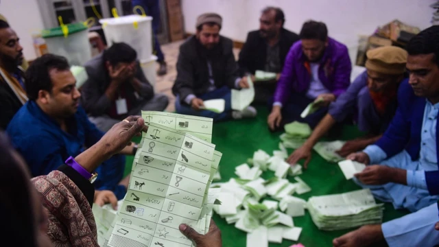 Polling staff start counting votes as polls end during country's national elections in Karachi, Pakistan on 8 February 2024. (Picture: AFP)