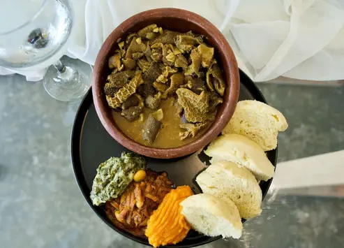 A soul-satisfying combination of mogodu, hard body chicken, pork trotters, and dumplings from Moving Feast. Picture: Katlego Jiyane/Eyewitness News A soul-satisfying combination of mogodu, hard body chicken, pork trotters, and dumplings from Moving Feast. Picture: Katlego Jiyane/Eyewitness News