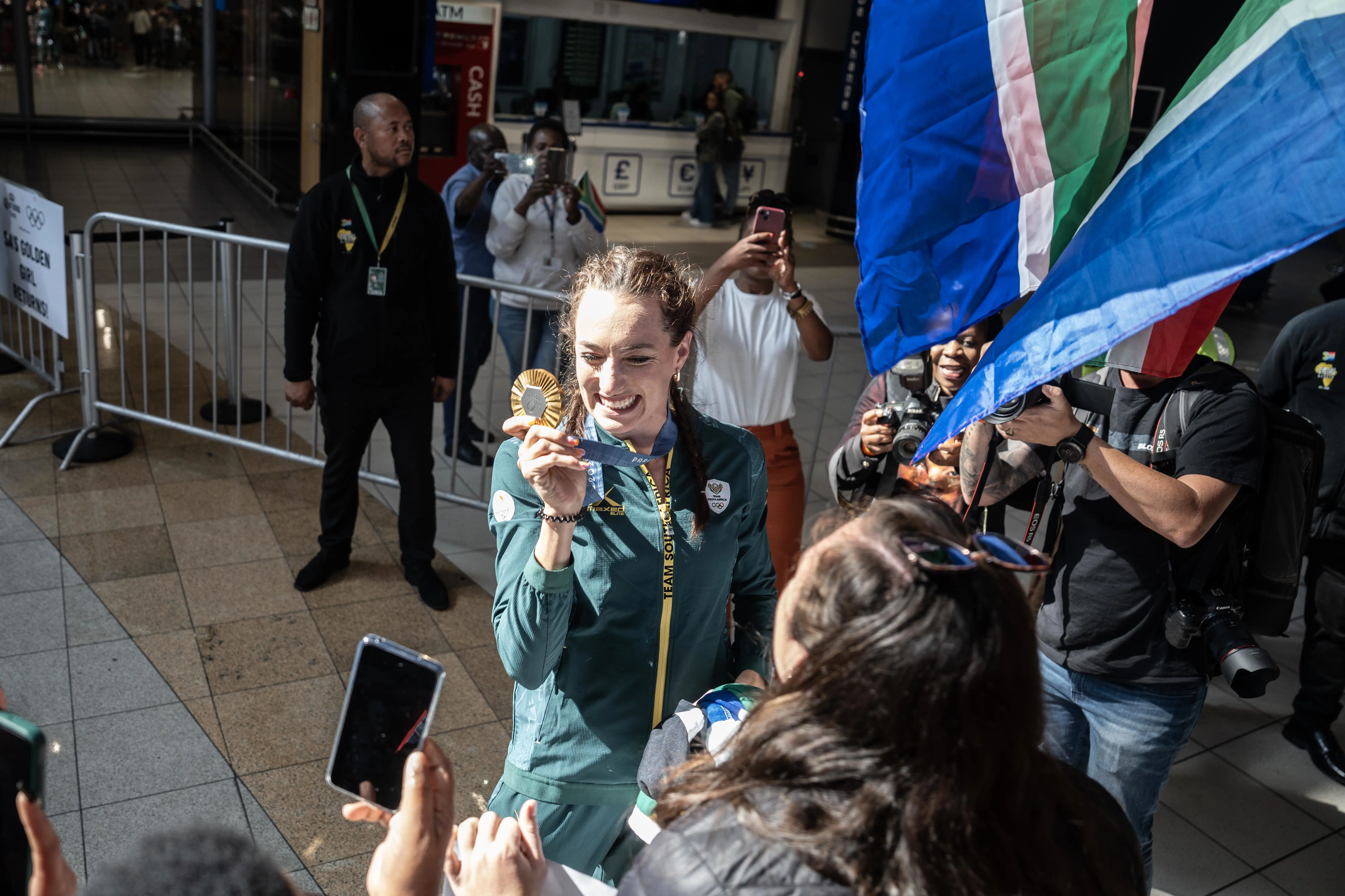 Gold Olympic medallist Tatjana Smith poses with her medal at OR Tambo International Airport Photo: Jacques Nelles/Eyewitness News Gold Olympic medallist Tatjana Smith poses with her medal at OR Tambo International Airport Photo: Jacques Nelles/Eyewitness News