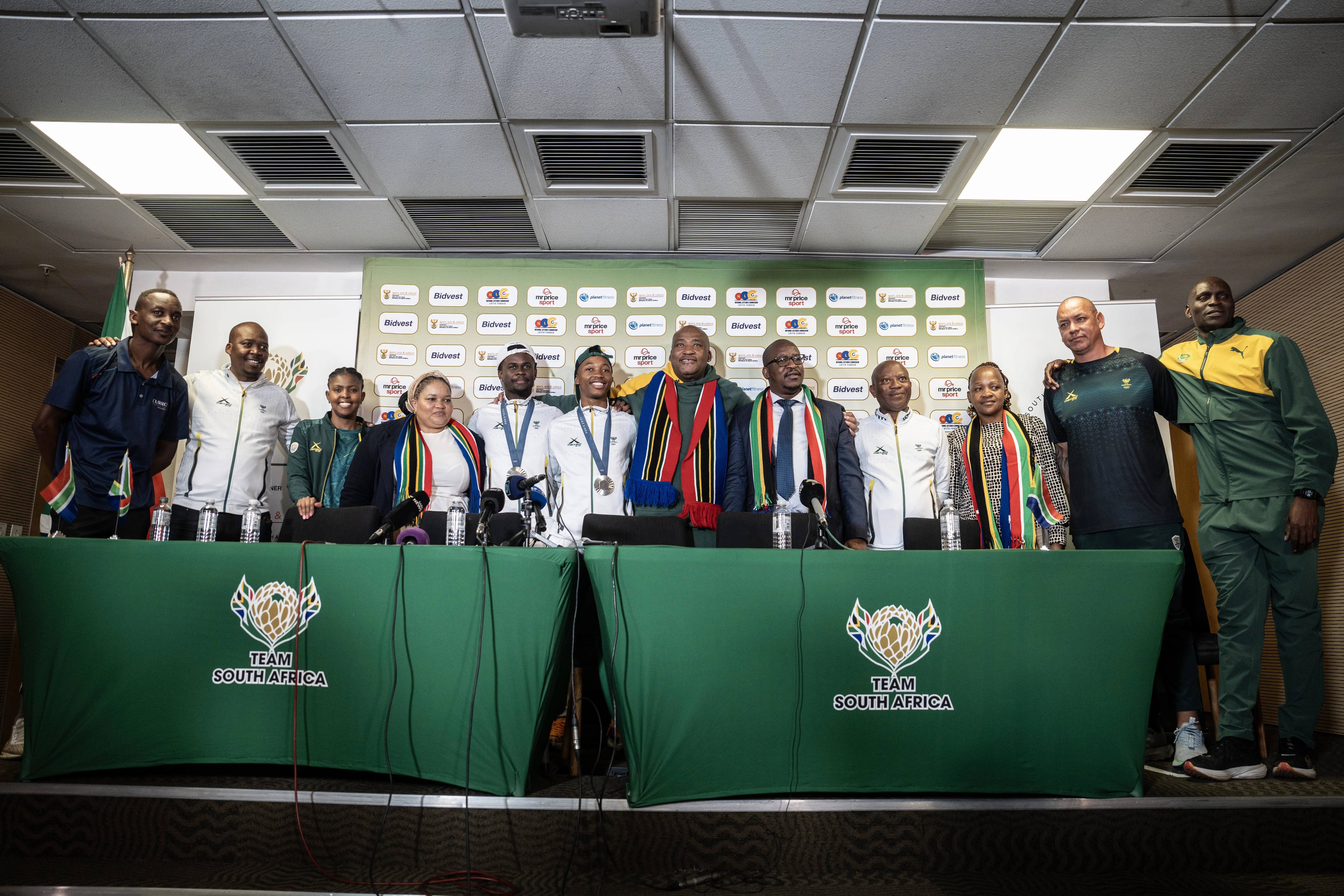 Silver Olympic medallists Bayanda Walaza and Bradley Nkoana with Sports, Arts and Culture Minister Gayton McKenzie and other officials at OR Tambo International Airport. Photo: Jacques Nelles/Eyewitness News Silver Olympic medallists Bayanda Walaza and Bradley Nkoana with Sports, Arts and Culture Minister Gayton McKenzie and other officials at OR Tambo International Airport. Photo: Jacques Nelles/Eyewitness News