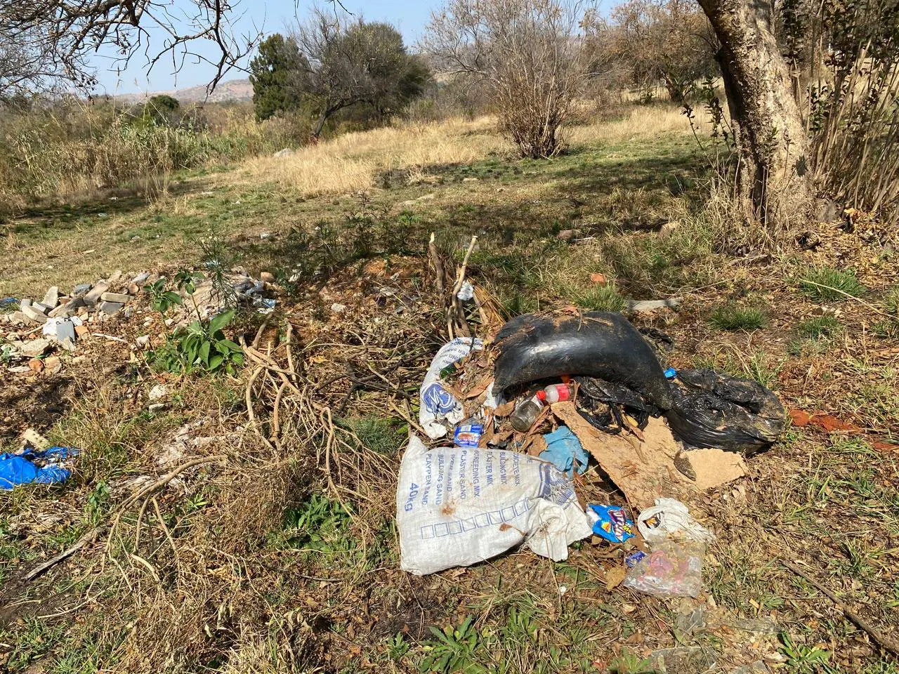 Before pictures of the field before Otukile Motshwaedi spent R200k of his own money transforming it. Image: Supplied. Before pictures of the field before Otukile Motshwaedi spent R200k of his own money transforming it. Image: Supplied.
