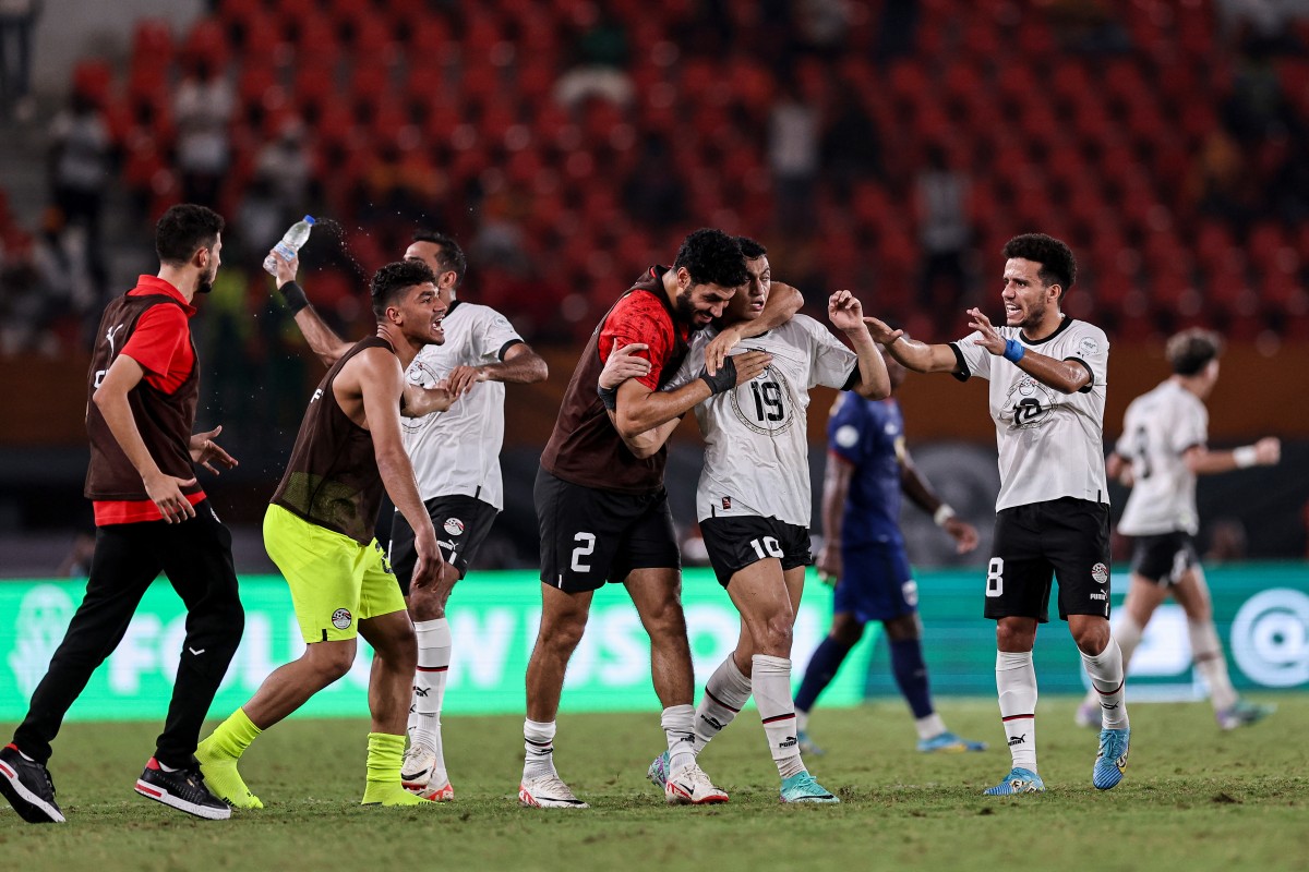Egypt's forward Mostafa Mohamed (2R) celebrates with teammates after scoring his team's second goal during the Africa Cup of Nations (CAN) 2024 group B football match between Cape Verde and Egypt at the Felix Houphouet-Boigny Stadium in Abidjan on 22 January 2024. [Picture: AFP]