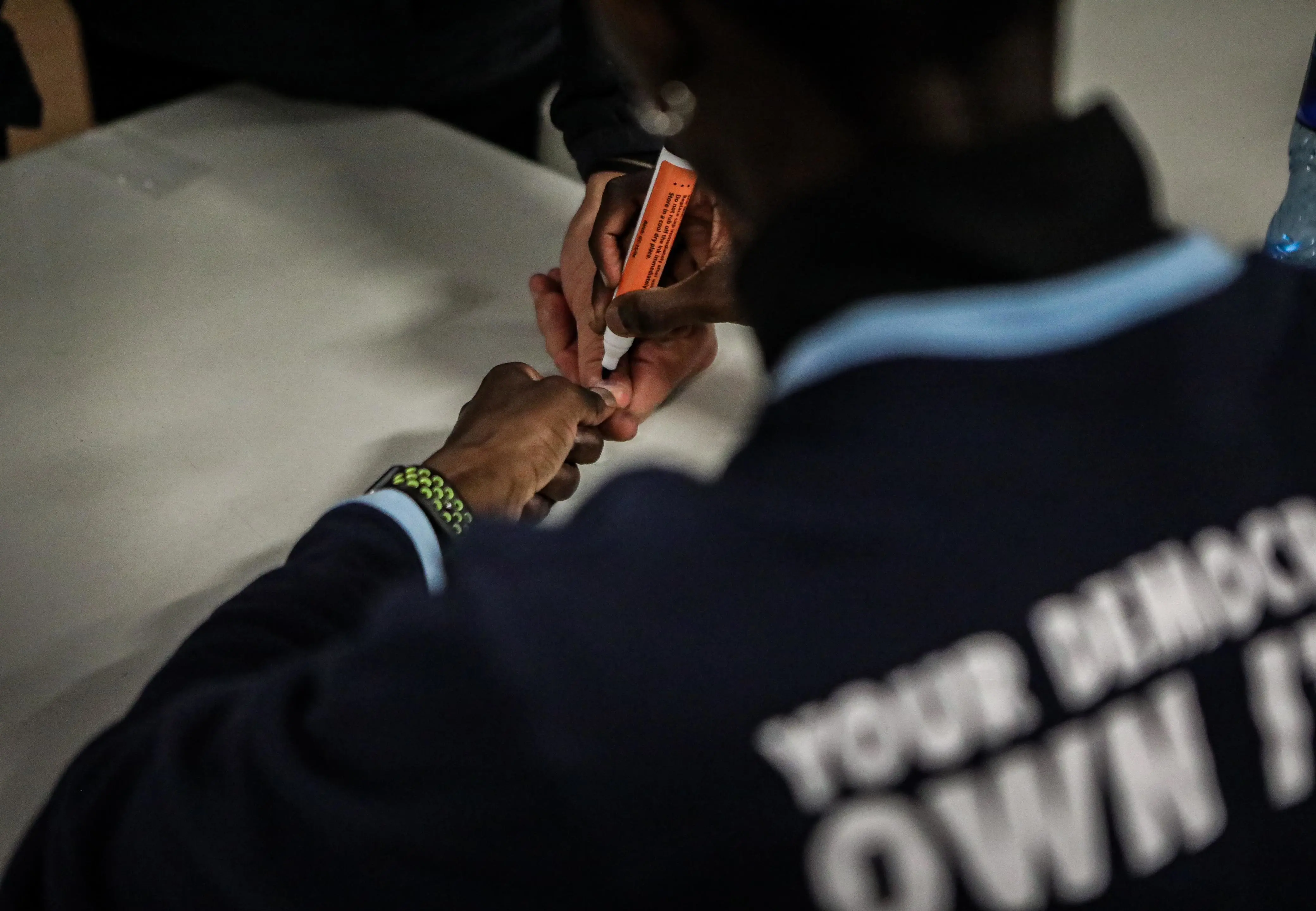 An IEC official marks the thumb of a prospective voter on 29 May 2024. Picture: Skhu Nkomphela/Eyewitness News An IEC official marks the thumb of a prospective voter on 29 May 2024. Picture: Skhu Nkomphela/Eyewitness News