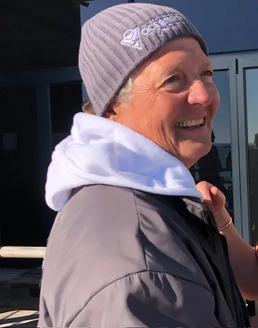 Wrapped up to help restore her body temperature, Karen Kennedy savours the moment after completing her quadruple Robben Island crossing – elated, exhausted and just over 10 hours later, triumphant. Picture: Supplied Wrapped up to help restore her body temperature, Karen Kennedy savours the moment after completing her quadruple Robben Island crossing – elated, exhausted and just over 10 hours later, triumphant. Picture: Supplied