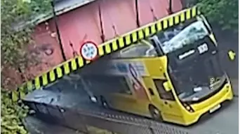 WATCH: Woman flung off bus after double-decker goes under too-low bridge WATCH: Woman flung off bus after double-decker goes under too-low bridge