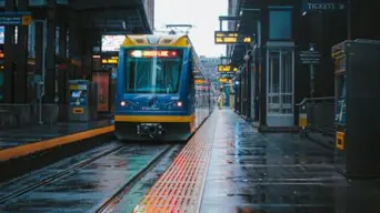 WATCH: Guard saves woman wearing headphones from being hit by oncoming tram WATCH: Guard saves woman wearing headphones from being hit by oncoming tram