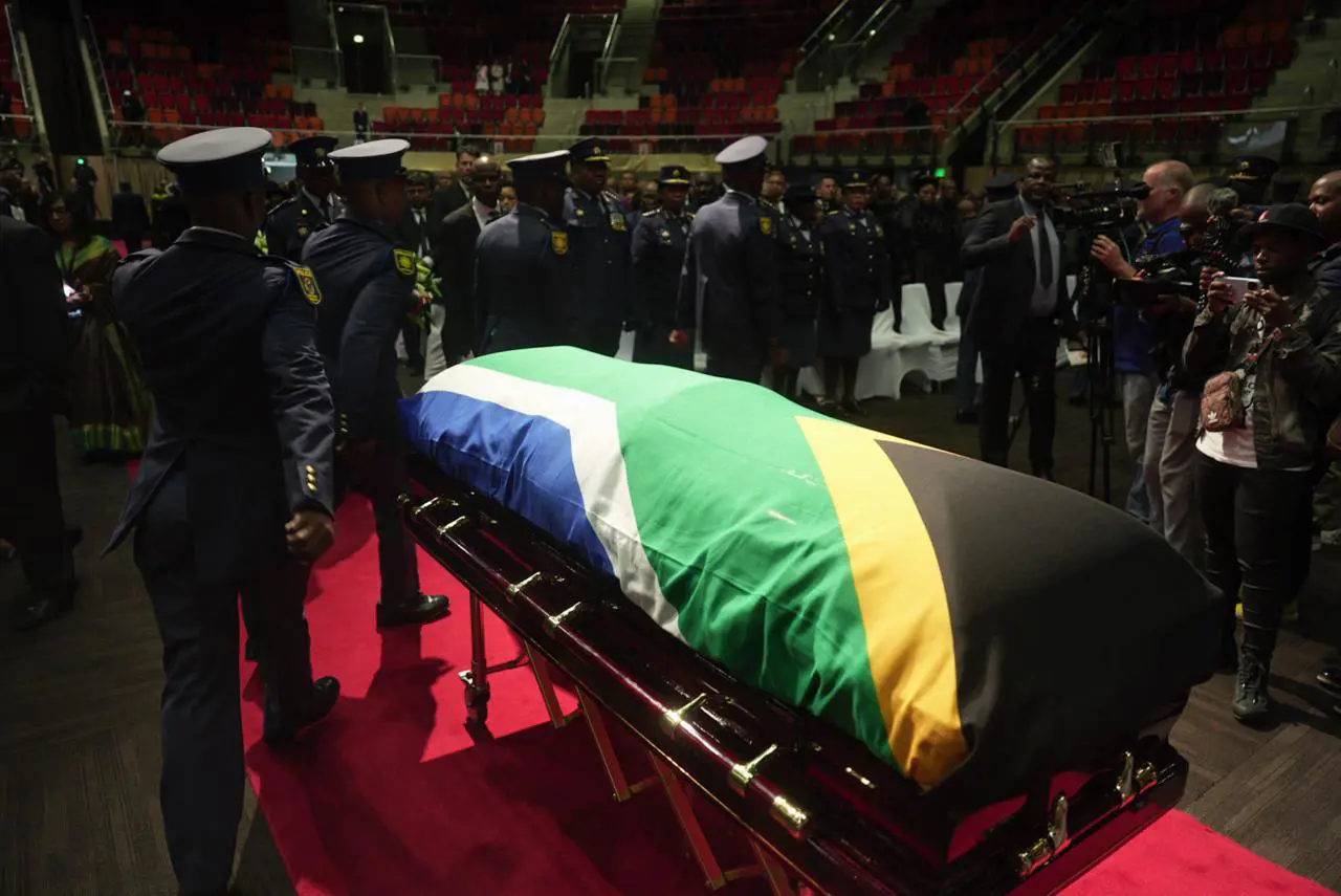 Late former minister Pravin Gordhan's body were escorted into the venue ahead of the start of the funeral proceedings. Picture: Jacques Nelles/Eyewitness News Late former minister Pravin Gordhan's body were escorted into the venue ahead of the start of the funeral proceedings. Picture: Jacques Nelles/Eyewitness News
