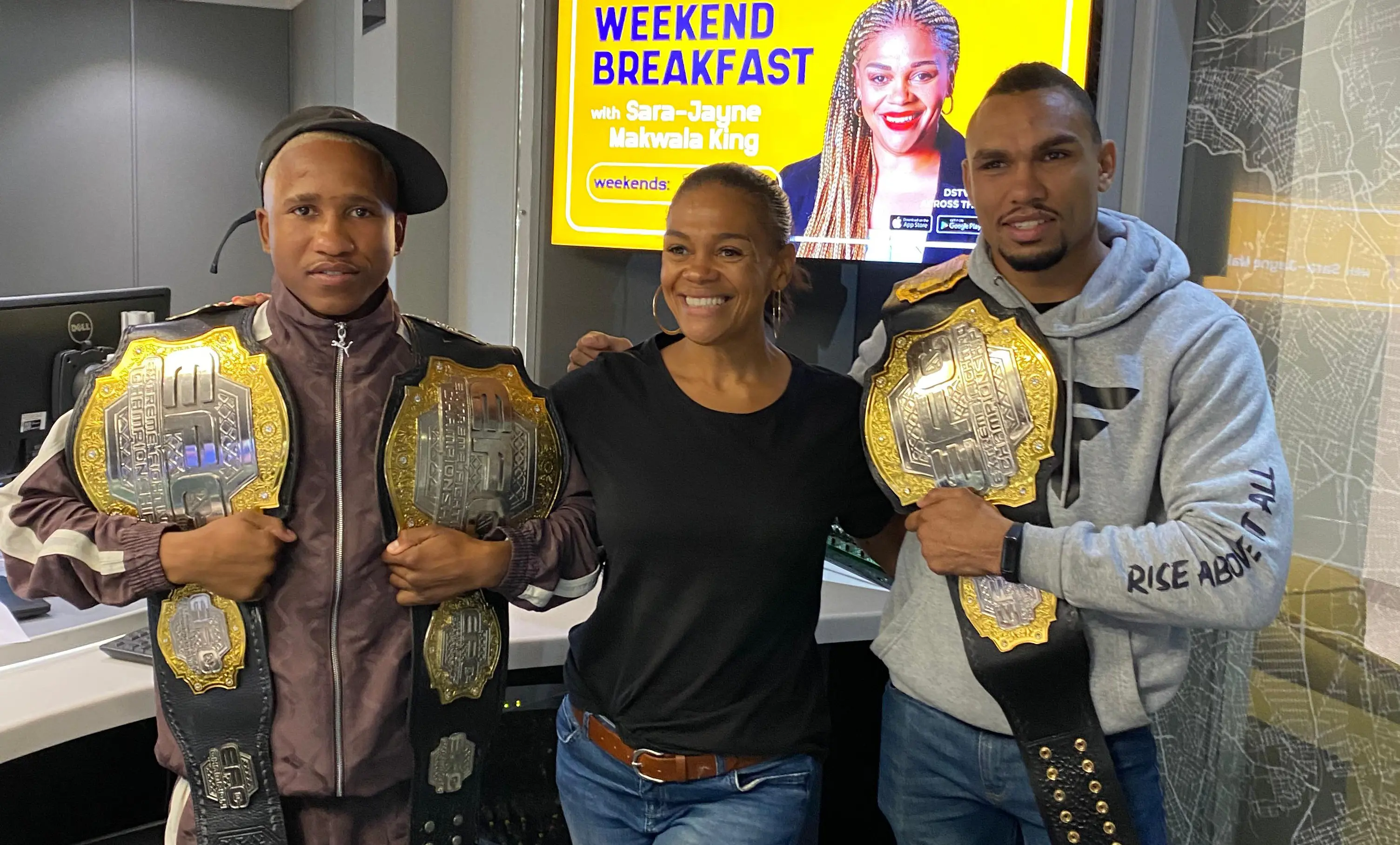EFC fighters Terence Balelo and Faeez Jacobs with Sara Jayne Makwala King, CapeTalk EFC fighters Terence Balelo and Faeez Jacobs with Sara Jayne Makwala King, CapeTalk
