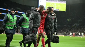 Liverpool sink nine-man Spurs but Isak limps off after rare goal Liverpool sink nine-man Spurs but Isak limps off after rare goal