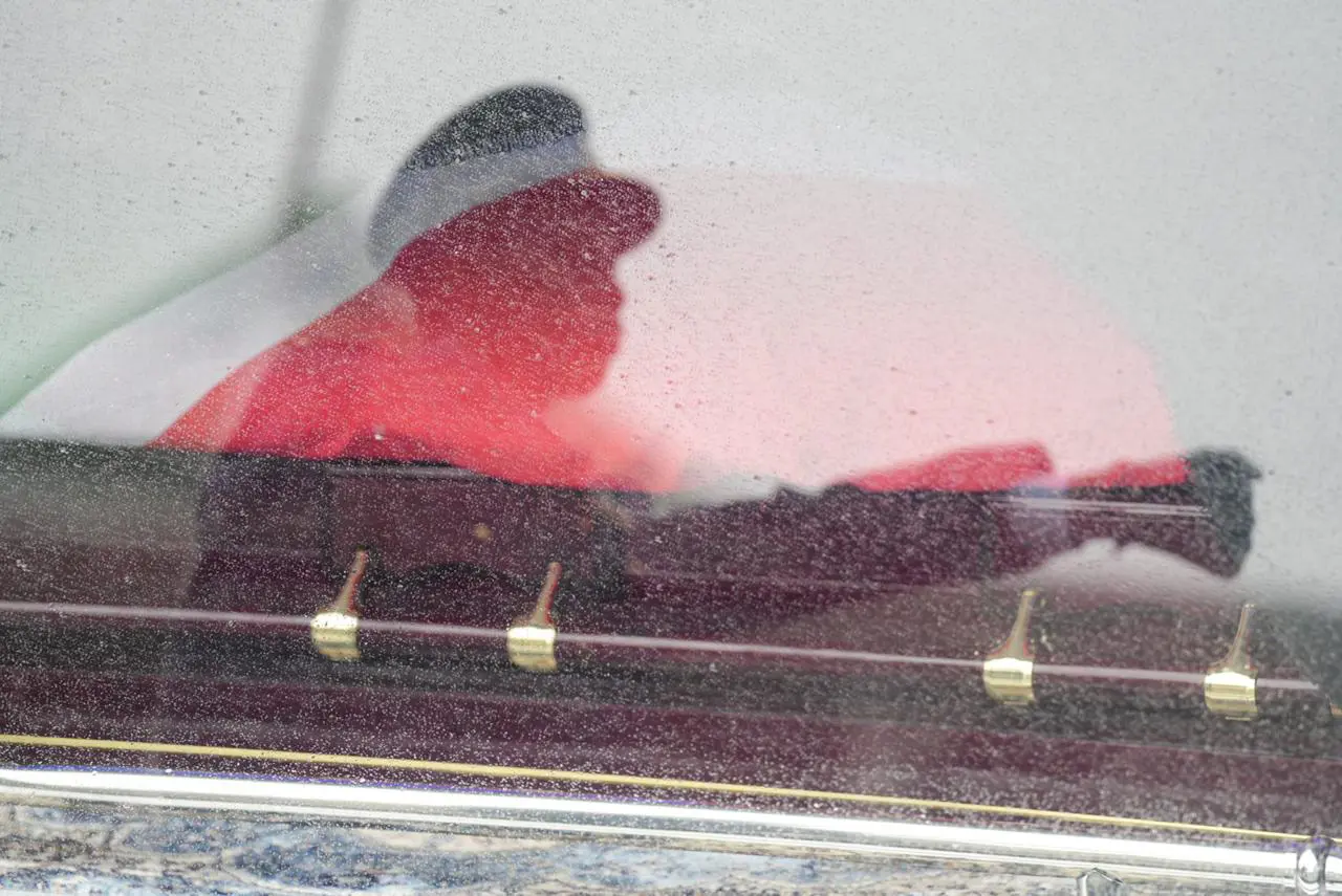A reflection of SAPs member against the hearse where former minister Pravin Gordhan's casket lays ahead of the funeral. Photo: Jacques Nelles/Eyewitness News A reflection of SAPs member against the hearse where former minister Pravin Gordhan's casket lays ahead of the funeral. Photo: Jacques Nelles/Eyewitness News