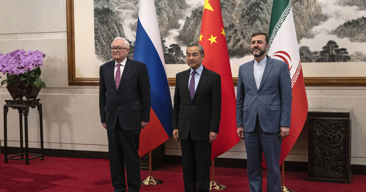 China urges end to 'illegal' sanctions as it hosts Iran nuclear talks