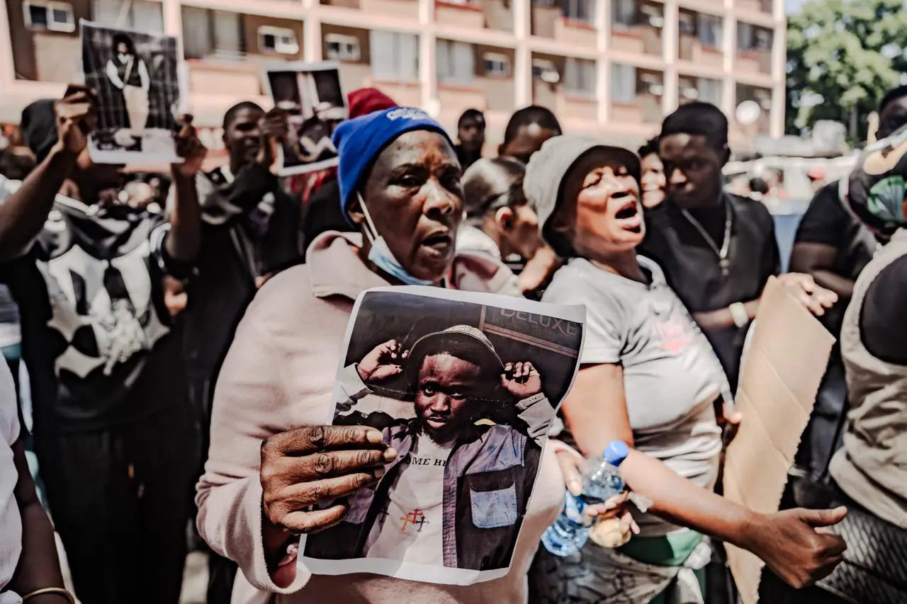 Members of the Nigerian Union, e-hailing driver associations and concerned citizens picketed outside holding signs demanding "Justice for Isaac. Photo: Sphamandla Dlamini Members of the Nigerian Union, e-hailing driver associations and concerned citizens picketed outside holding signs demanding "Justice for Isaac. Photo: Sphamandla Dlamini