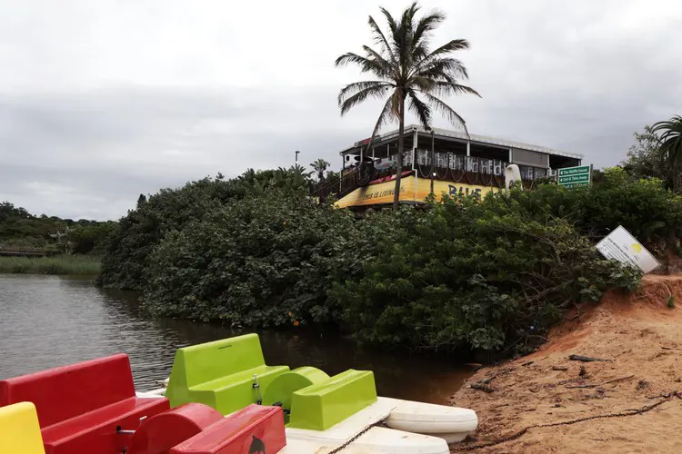 A faded sign that has fallen over warns that the lagoon at Ramsgate main beach is 'under strict monitoring for any possible contamination'. While this river, the Bilanhlolo, does not have a sewage treatment works releasing effluent into it, it is regularly contaminated by sewage spills. Picture: Steve Kretzmann/GroundUp A faded sign that has fallen over warns that the lagoon at Ramsgate main beach is 'under strict monitoring for any possible contamination'. While this river, the Bilanhlolo, does not have a sewage treatment works releasing effluent into it, it is regularly contaminated by sewage spills. Picture: Steve Kretzmann/GroundUp
