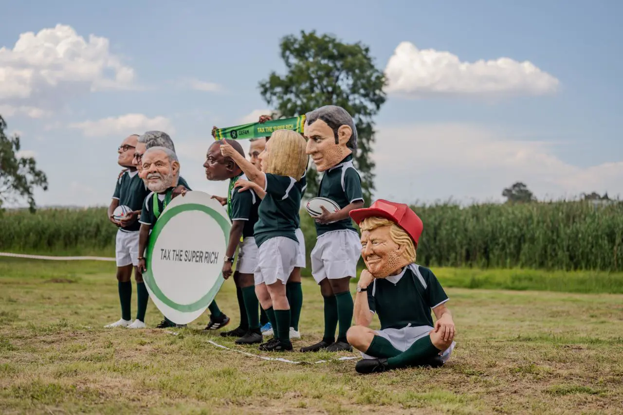 Activists from Oxfarm wearing puppet heads of world leaders. Photo: Sphamandla Dlamini Activists from Oxfarm wearing puppet heads of world leaders. Photo: Sphamandla Dlamini