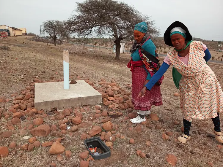 Jabu Mthembu (left) and Duduzile Sokhela say some water infrastructure was installed but without taps, and has never worked. Picture: Bongane Motaung/GroundUp Jabu Mthembu (left) and Duduzile Sokhela say some water infrastructure was installed but without taps, and has never worked. Picture: Bongane Motaung/GroundUp