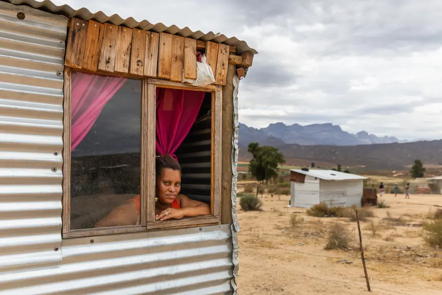 Anna April has lived in the informal settlement of Sandkamp for two years. She said the biggest challenge is not having electricity, which means it is not safe at night. Photo: Ashraf Hendricks/GroundUp Anna April has lived in the informal settlement of Sandkamp for two years. She said the biggest challenge is not having electricity, which means it is not safe at night. Photo: Ashraf Hendricks/GroundUp