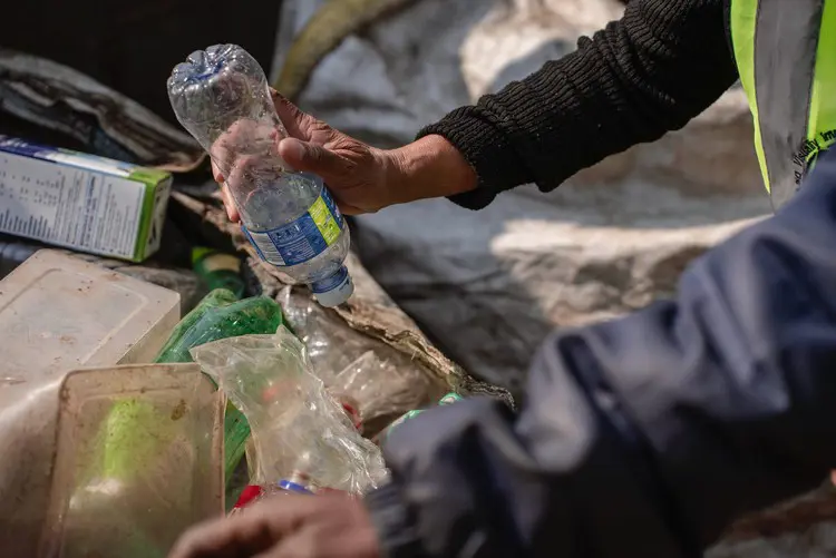 Visually impaired activists use their hands to feel for recyclable objects. Picture: Ihsaan Haffejee/GroundUp Visually impaired activists use their hands to feel for recyclable objects. Picture: Ihsaan Haffejee/GroundUp