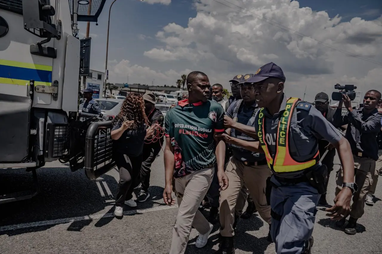 Police arrest members of Operation Dudula outside the Nasrec Expo centre where the G20 leaders' Summit took place. Photo: Sphamandla Dlamini Police arrest members of Operation Dudula outside the Nasrec Expo centre where the G20 leaders' Summit took place. Photo: Sphamandla Dlamini