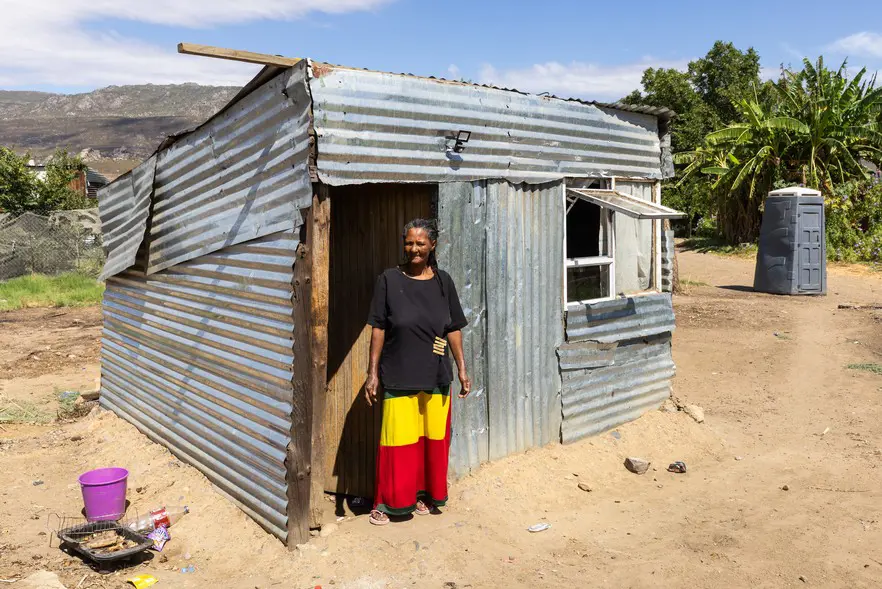 Magdalene Witbooi stands in front of her home in Rastakamp, Citrusdal. Photo: Ashraf Hendricks/GroundUp Magdalene Witbooi stands in front of her home in Rastakamp, Citrusdal. Photo: Ashraf Hendricks/GroundUp