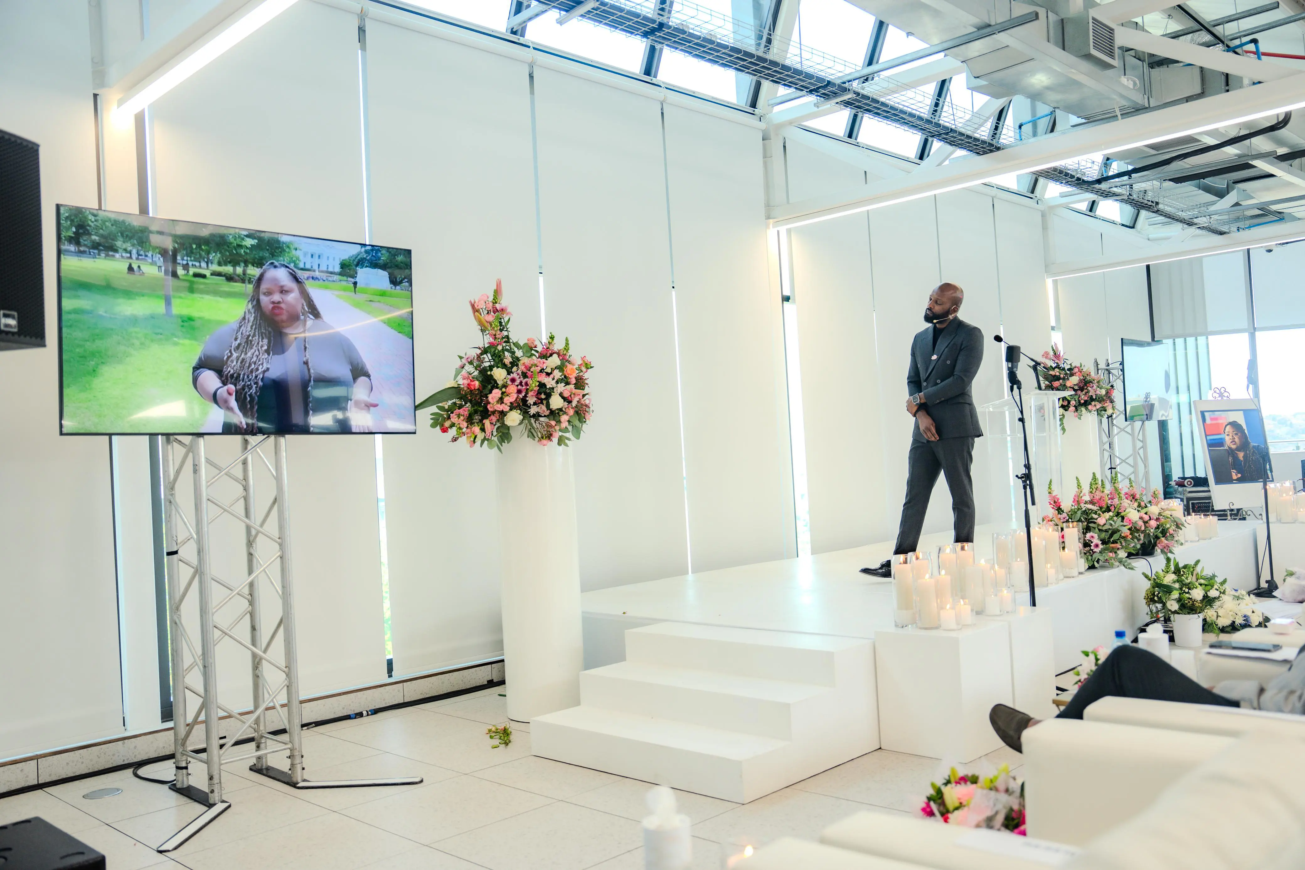 Programme director, Clement Manyathela, watches a video of Tshidi Madia at her memorial service at Primedia's headquarters in Sandton, Johannesburg on 2 September. Picture: Sphamandla Dlamini & Katlego Jiyane/EWN Programme director, Clement Manyathela, watches a video of Tshidi Madia at her memorial service at Primedia's headquarters in Sandton, Johannesburg on 2 September. Picture: Sphamandla Dlamini & Katlego Jiyane/EWN