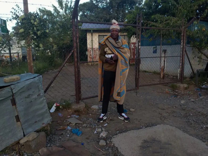 Makaliso Mawene, a farm worker in the Eastern Cape, slept outside the Mohale’s Hoek office from 9pm. He was 14th in the queue to be helped when the office opened at 8am. Picture: Sechaba Mokhethi/@GroundUp News Makaliso Mawene, a farm worker in the Eastern Cape, slept outside the Mohale’s Hoek office from 9pm. He was 14th in the queue to be helped when the office opened at 8am. Picture: Sechaba Mokhethi/@GroundUp News